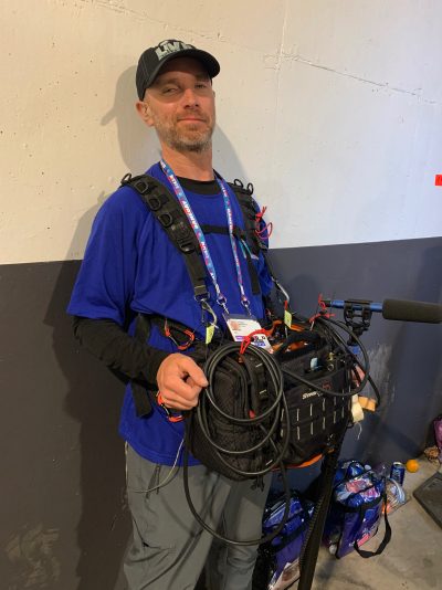 Joe Bohannon in full production sound rig harness and boom pole on NFL Films game day